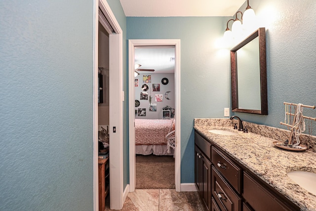 506 Scarlet Oaks Cv, Benton, AR 72019 - ensuite bathroom with double vanity and a textured wall