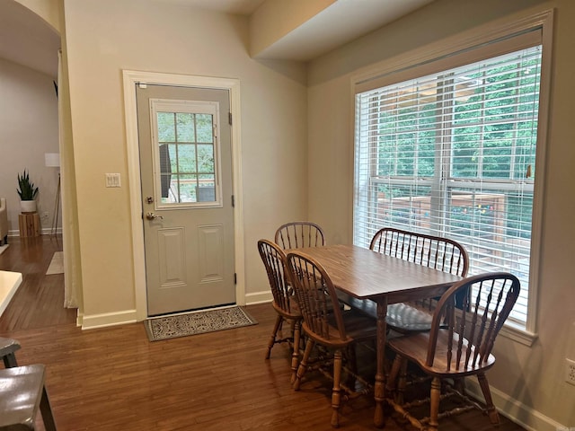3 Timber Ridge Cir, Arkadelphia, AR 71923 - dining area featuring dark wood-style flooring and arched walkways