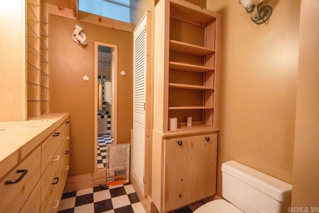 1032 Nunis Dr, Heber Springs, AR 72543 - bathroom with tile patterned floors, vanity, and a closet