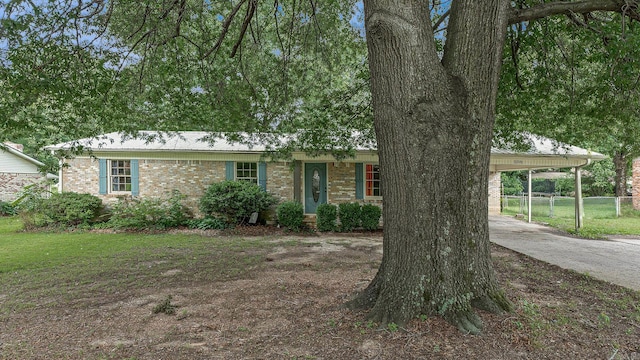 508 Cindy St, Paragould, AR 72450 - ranch-style house featuring an attached carport, brick siding, and concrete driveway