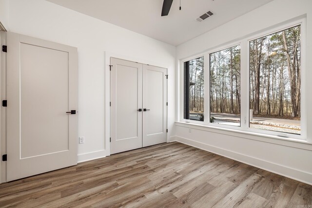 60 Estrella Way, Hot Springs Village, AR 71909 - unfurnished bedroom featuring light wood-style floors, a closet, and a ceiling fan
