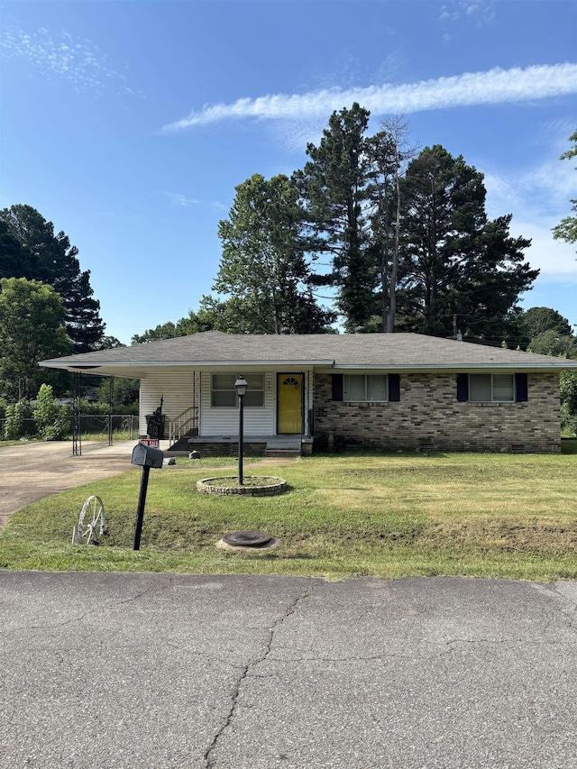 513 Joyce, Searcy, AR 72143 - ranch-style home with driveway, a front yard, and an attached carport