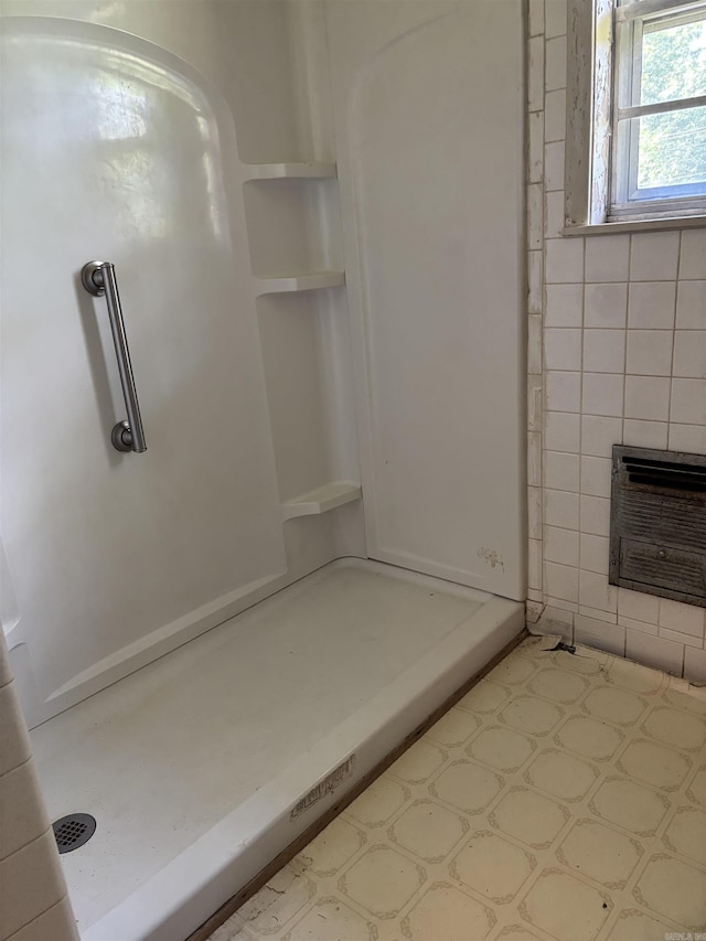 513 Joyce, Searcy, AR 72143 - full bathroom with a shower, a tile fireplace, and a wall unit AC