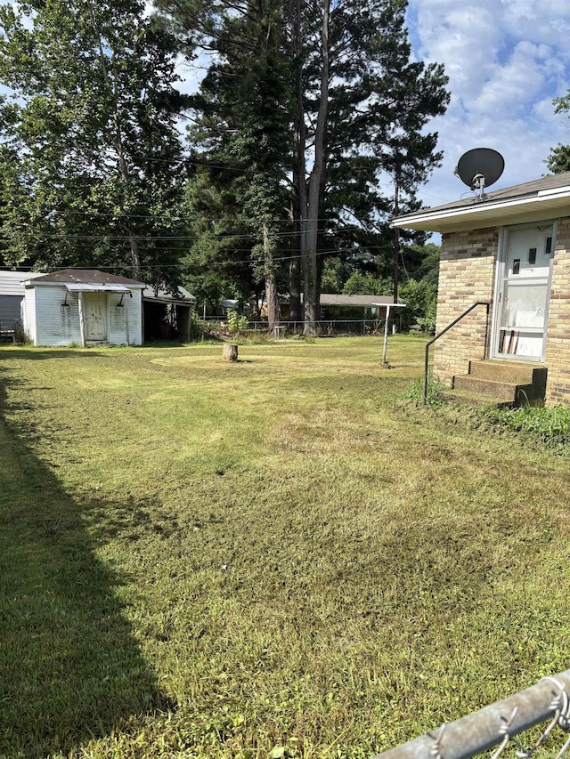 513 Joyce, Searcy, AR 72143 - view of green lawn featuring entry steps and a shed