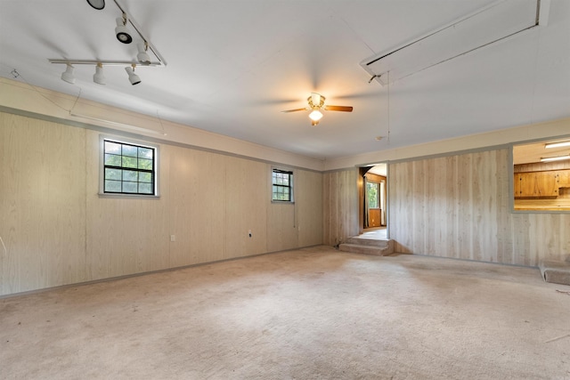 7025 Windsong, North Little Rock, AR 72113 - spare room with attic access, plenty of natural light, carpet floors, a ceiling fan, and wooden walls