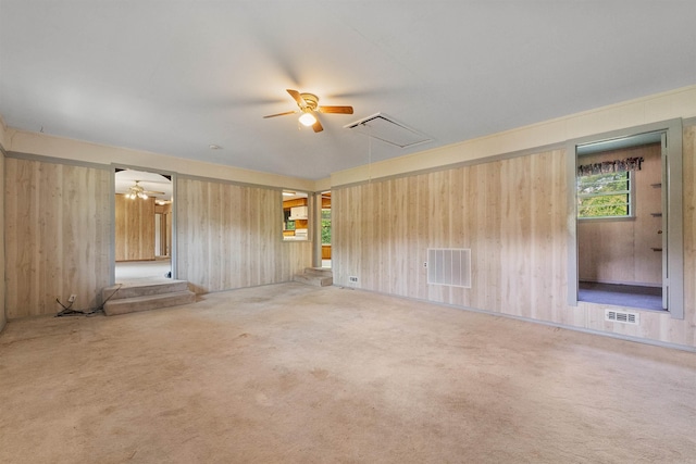 7025 Windsong, North Little Rock, AR 72113 - unfurnished living room with attic access, a ceiling fan, carpet flooring, and wooden walls