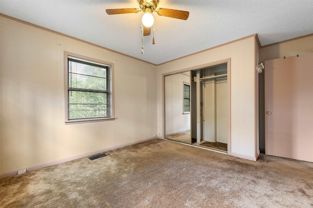 7025 Windsong, North Little Rock, AR 72113 - unfurnished bedroom featuring crown molding, carpet, a closet, and a ceiling fan