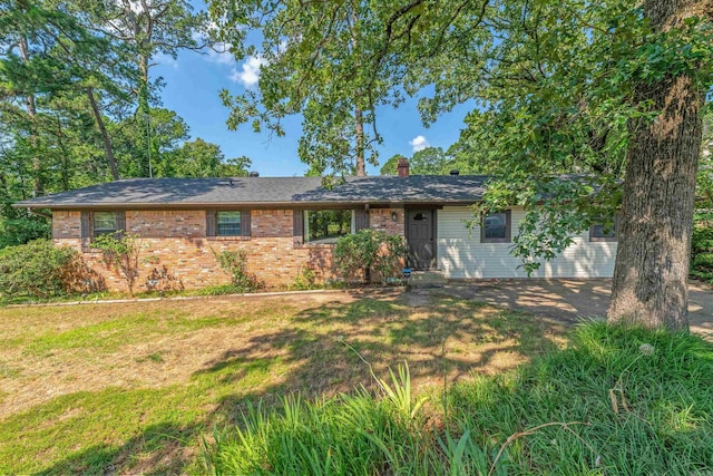7025 Windsong, North Little Rock, AR 72113 - ranch-style home with a chimney, a front yard, and brick siding