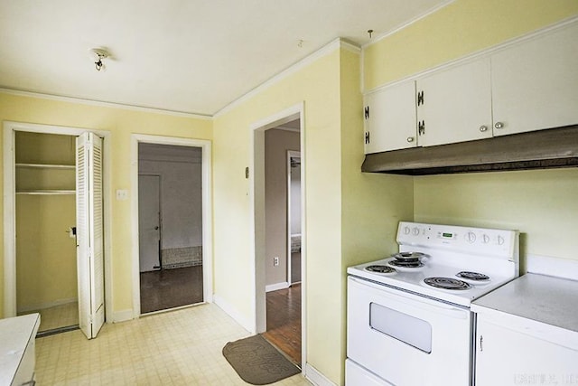 1810 N Mississippi, Little Rock, AR 72227 - kitchen with white electric range oven, under cabinet range hood, white cabinetry, ornamental molding, and light countertops