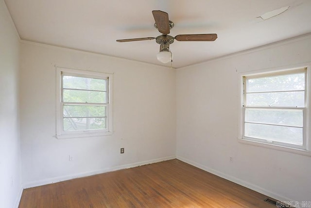 1810 N Mississippi, Little Rock, AR 72227 - unfurnished room featuring plenty of natural light, wood finished floors, ceiling fan, and ornamental molding