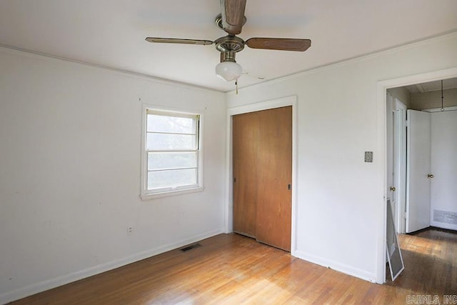 1810 N Mississippi, Little Rock, AR 72227 - unfurnished bedroom featuring light wood finished floors, attic access, a closet, crown molding, and a ceiling fan