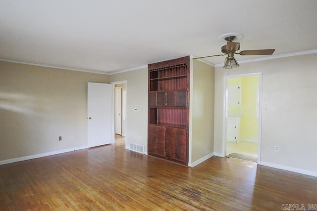 1810 N Mississippi, Little Rock, AR 72227 - unfurnished room with ceiling fan, wood finished floors, and ornamental molding