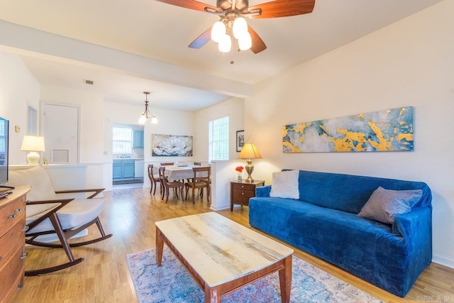 4624 W 29th St, Little Rock, AR 72204 - living room with light wood-style flooring, ceiling fan, and a chandelier