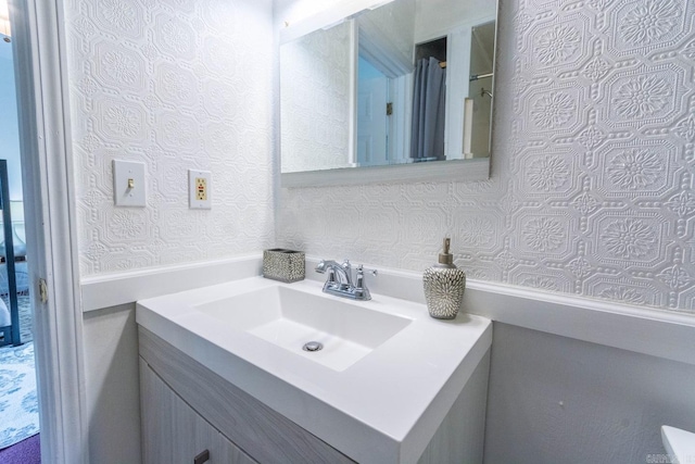 4624 W 29th St, Little Rock, AR 72204 - bathroom with vanity and wallpapered walls