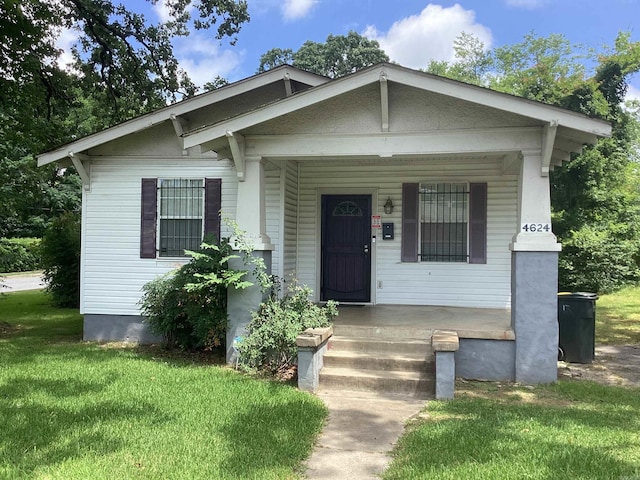 4624 W 29th St, Little Rock, AR 72204 - bungalow with a porch and a front lawn