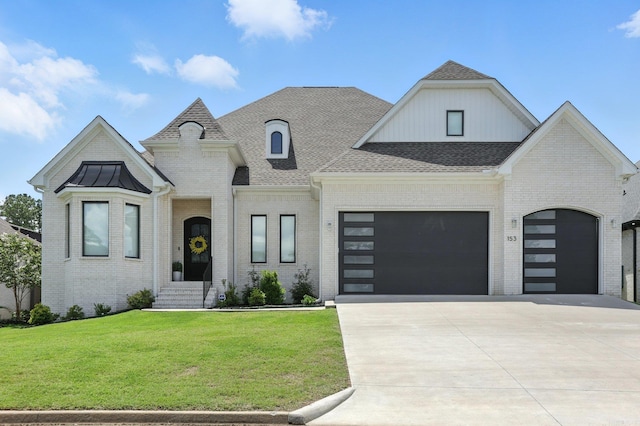 153 Caurel Cir, Little Rock, AR 72223 - french country inspired facade featuring an attached garage, a front yard, driveway, and brick siding
