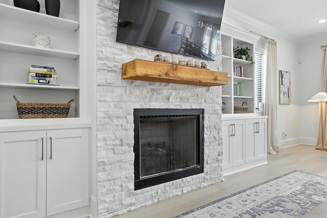 153 Caurel Cir, Little Rock, AR 72223 - living room with wood finished floors, crown molding, a fireplace, built in features, and recessed lighting