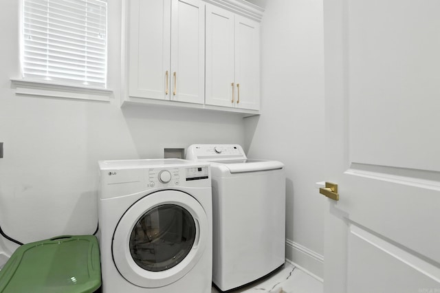 153 Caurel Cir, Little Rock, AR 72223 - laundry room featuring washing machine and clothes dryer, cabinet space, and marble look tiles