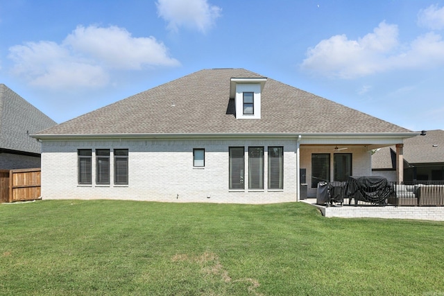 153 Caurel Cir, Little Rock, AR 72223 - back of property featuring a fenced backyard, ceiling fan, roof with shingles, brick siding, and a patio area