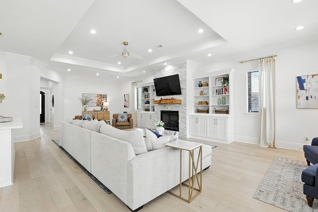 153 Caurel Cir, Little Rock, AR 72223 - living area with a raised ceiling, recessed lighting, ceiling fan, light wood-style flooring, and a fireplace