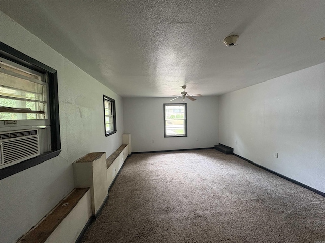 100 E Lincoln Ave, Searcy, AR 72143 - carpeted empty room featuring a ceiling fan, a textured ceiling, and cooling unit