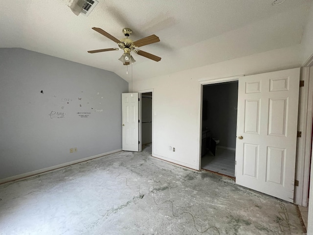 3806 Winterbrook Dr, Benton, AR 72015 - unfurnished bedroom featuring a spacious closet, connected bathroom, lofted ceiling, a ceiling fan, and a textured ceiling