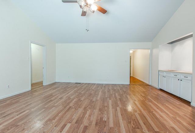 81 Stoneledge Dr, Maumelle, AR 72113 - unfurnished living room featuring vaulted ceiling, light wood-style floors, and ceiling fan