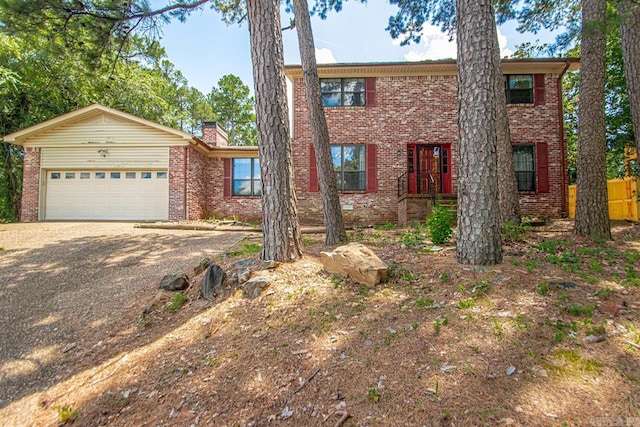 12605 Janelle Ct, Little Rock, AR 72205 - view of front of property featuring brick siding, dirt driveway, a garage, and a chimney