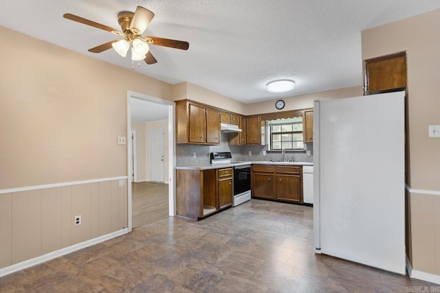12605 Janelle Ct, Little Rock, AR 72205 - kitchen featuring white appliances, light countertops, a ceiling fan, under cabinet range hood, and a textured ceiling