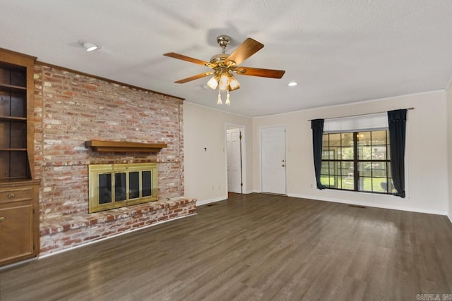 12605 Janelle Ct, Little Rock, AR 72205 - unfurnished living room with wood finished floors, ceiling fan, crown molding, and a brick fireplace