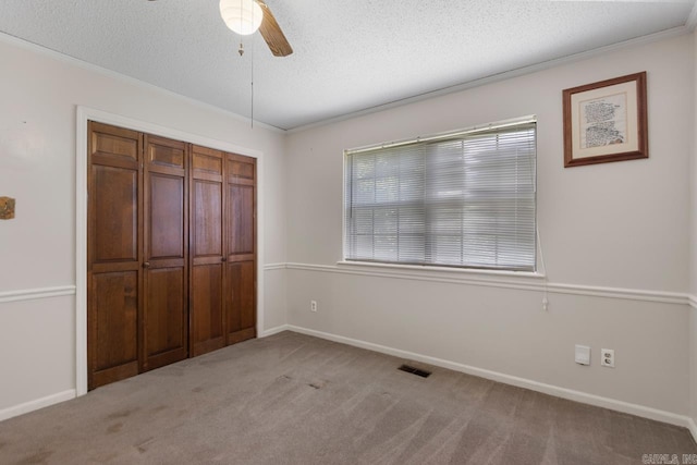 12605 Janelle Ct, Little Rock, AR 72205 - unfurnished bedroom with carpet floors, a textured ceiling, ornamental molding, ceiling fan, and a closet