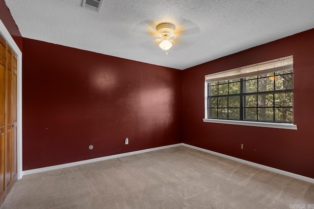 12605 Janelle Ct, Little Rock, AR 72205 - spare room featuring a ceiling fan, a textured ceiling, and carpet floors