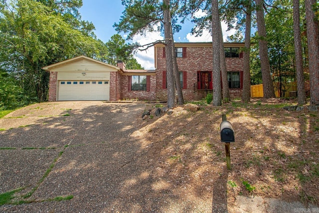 12605 Janelle Ct, Little Rock, AR 72205 - view of front facade featuring brick siding, driveway, a chimney, and a garage
