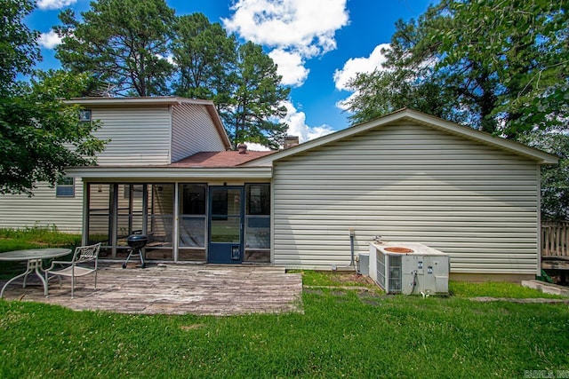 12605 Janelle Ct, Little Rock, AR 72205 - rear view of property with a yard, a sunroom, a patio area, and a chimney