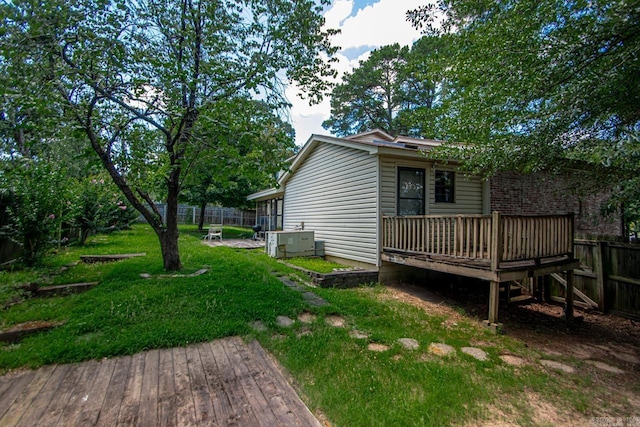 12605 Janelle Ct, Little Rock, AR 72205 - view of property exterior with a wooden deck and a central air condition unit