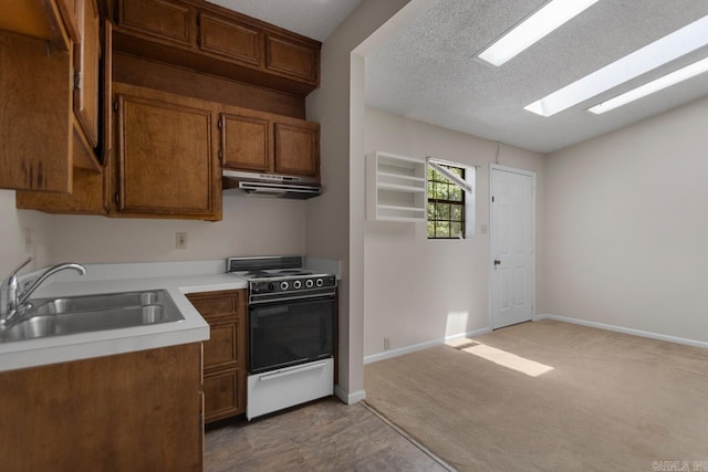 12605 Janelle Ct, Little Rock, AR 72205 - kitchen featuring white range with electric cooktop, under cabinet range hood, light countertops, brown cabinets, and a textured ceiling