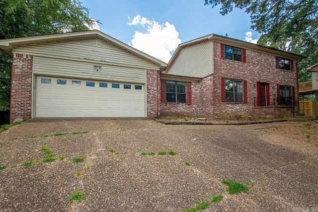 12605 Janelle Ct, Little Rock, AR 72205 - view of front of property with concrete driveway, brick siding, and a garage