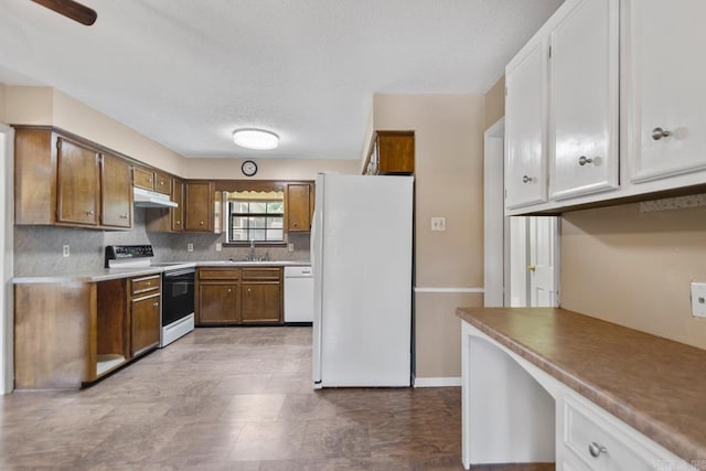 12605 Janelle Ct, Little Rock, AR 72205 - kitchen featuring white appliances, under cabinet range hood, backsplash, built in study area, and white cabinets