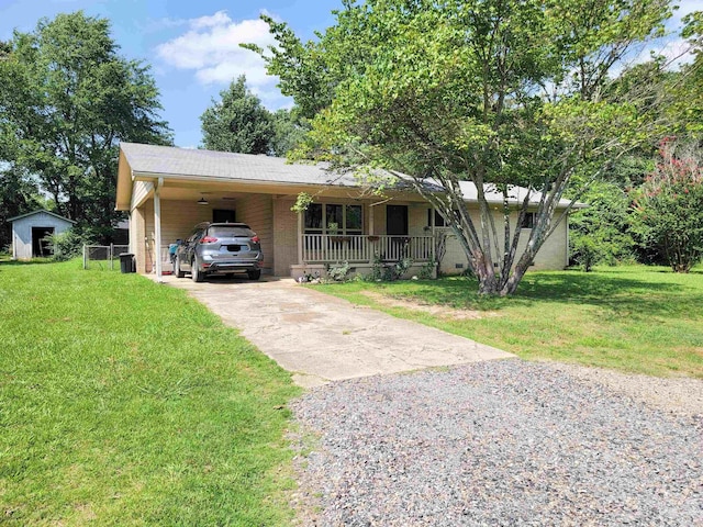 1209 Cole Ave, Mena, AR 71953 - single story home featuring gravel driveway, a front lawn, a porch, and a carport