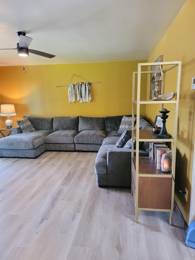 1209 Cole Ave, Mena, AR 71953 - living room featuring light wood-style flooring and a ceiling fan