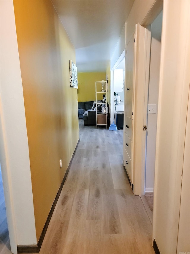 1209 Cole Ave, Mena, AR 71953 - corridor featuring light wood-type flooring