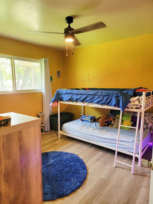 1209 Cole Ave, Mena, AR 71953 - bedroom featuring wood finished floors and ceiling fan