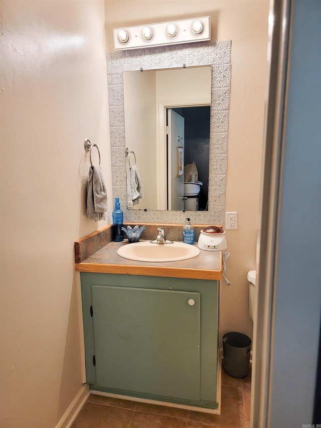 1209 Cole Ave, Mena, AR 71953 - half bath with vanity and tile patterned flooring