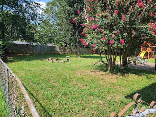1209 Cole Ave, Mena, AR 71953 - view of yard with a playground
