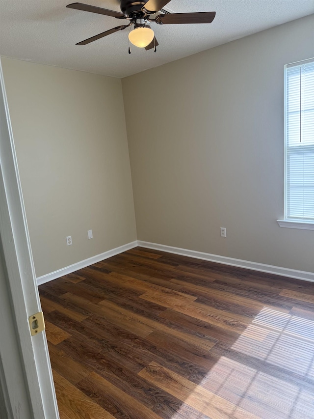 609 Scenic Vly, Heber Springs, AR 72543 - unfurnished room featuring a ceiling fan, dark wood-style floors, and plenty of natural light