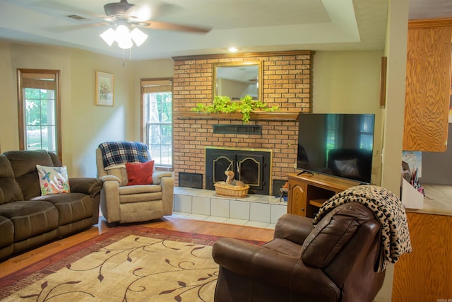 85 Linder Rd, Greenbrier, AR 72058 - living area with ceiling fan, wood finished floors, and a brick fireplace