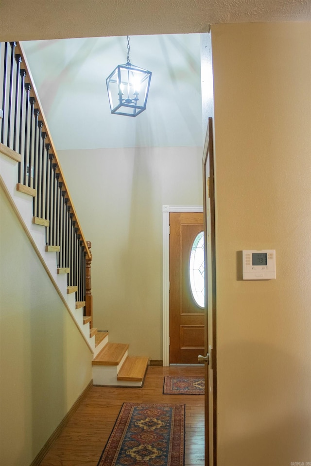 85 Linder Rd, Greenbrier, AR 72058 - foyer with wood finished floors, stairs, and a chandelier