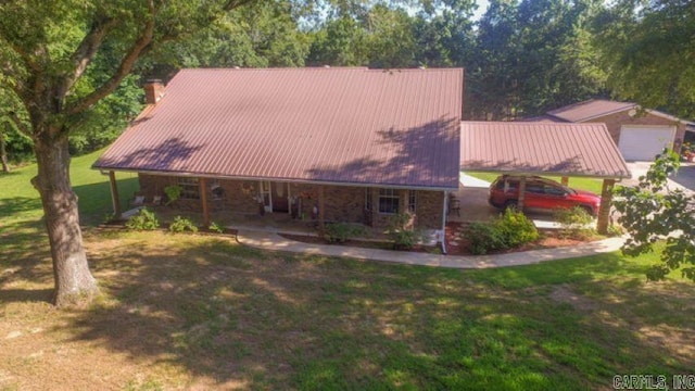 85 Linder Rd, Greenbrier, AR 72058 - view of front of house featuring a front lawn, a chimney, a metal roof, and covered porch