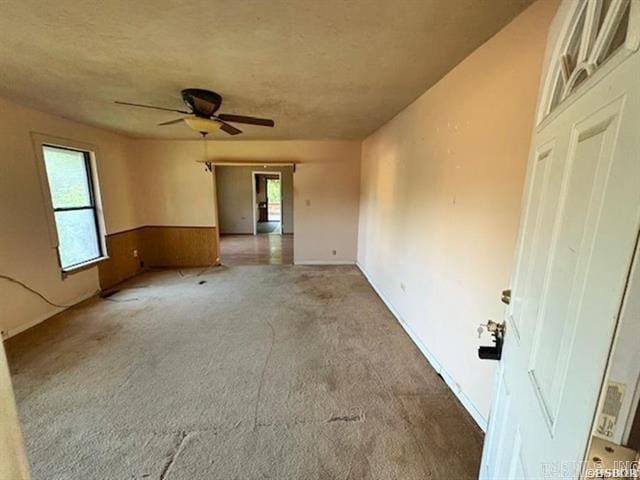 6430 Park Ave, Hot Springs, AR 71901 - spare room with healthy amount of natural light, carpet, ceiling fan, and wainscoting