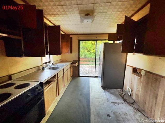 6430 Park Ave, Hot Springs, AR 71901 - kitchen with range with electric cooktop, freestanding refrigerator, and light countertops
